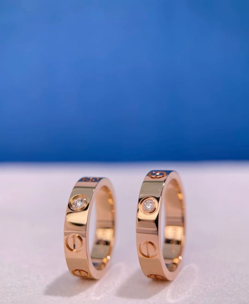 Gold love bracelet by cartier with screws representing eternal love and commitment.