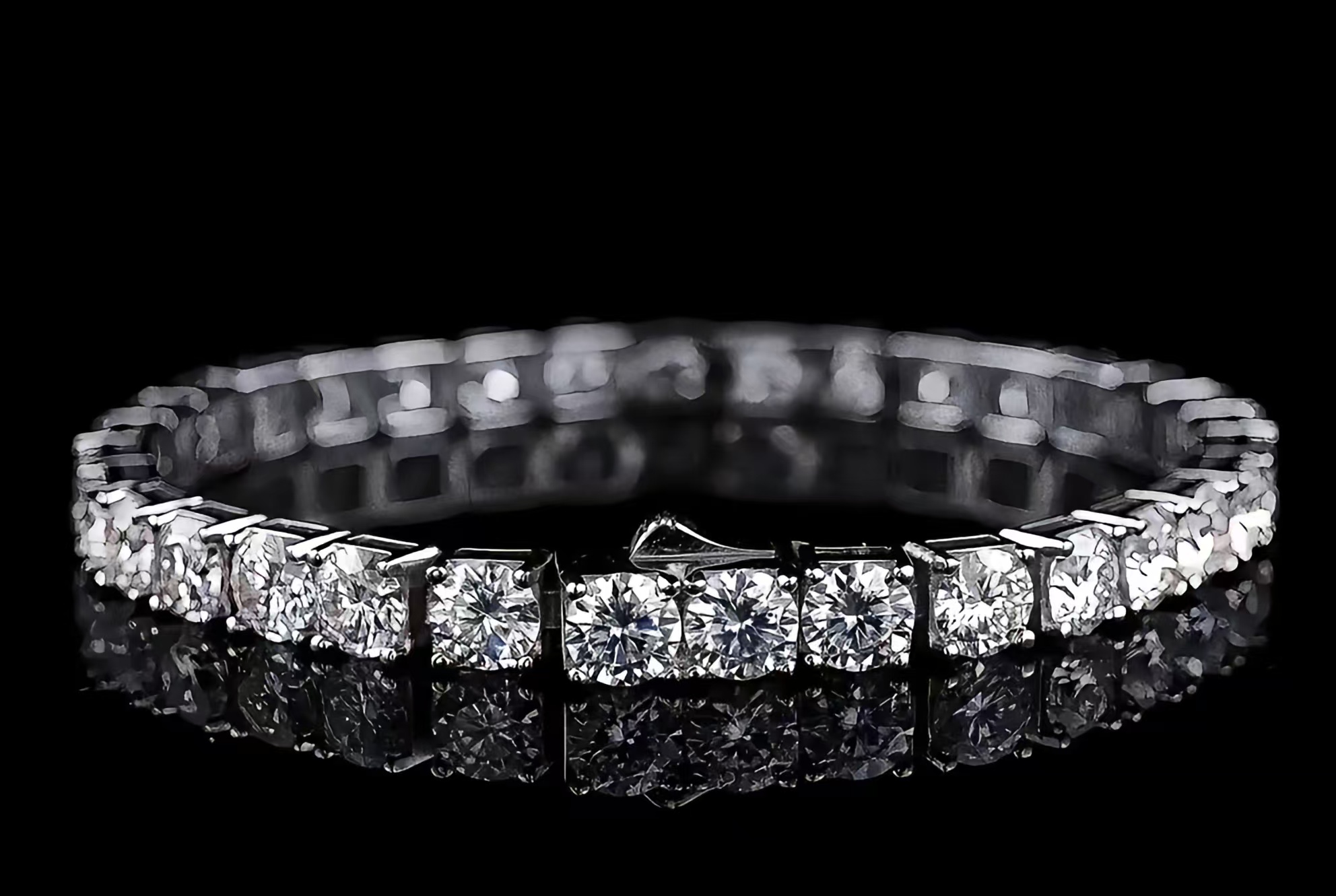 A timeless diamond tennis bracelet exquisitely designed with a row of smaller, closely set sparkling diamonds.