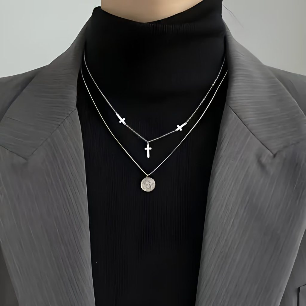 High-neck solid color base shirt embedded with a layered necklace to create a contemporary winter outfits appearance.